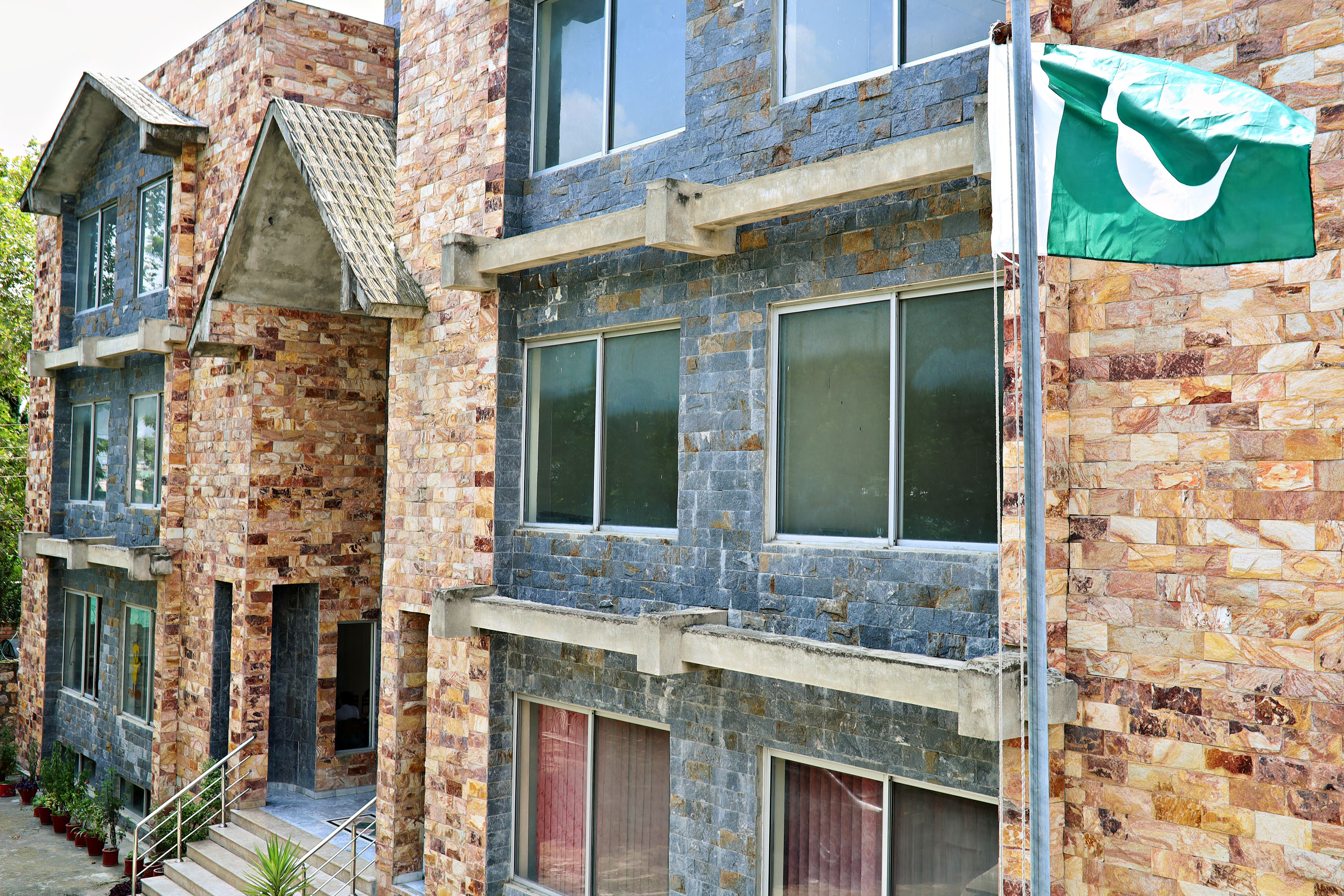 The Present Times campus, with the flag of Pakistan flying above the entrance